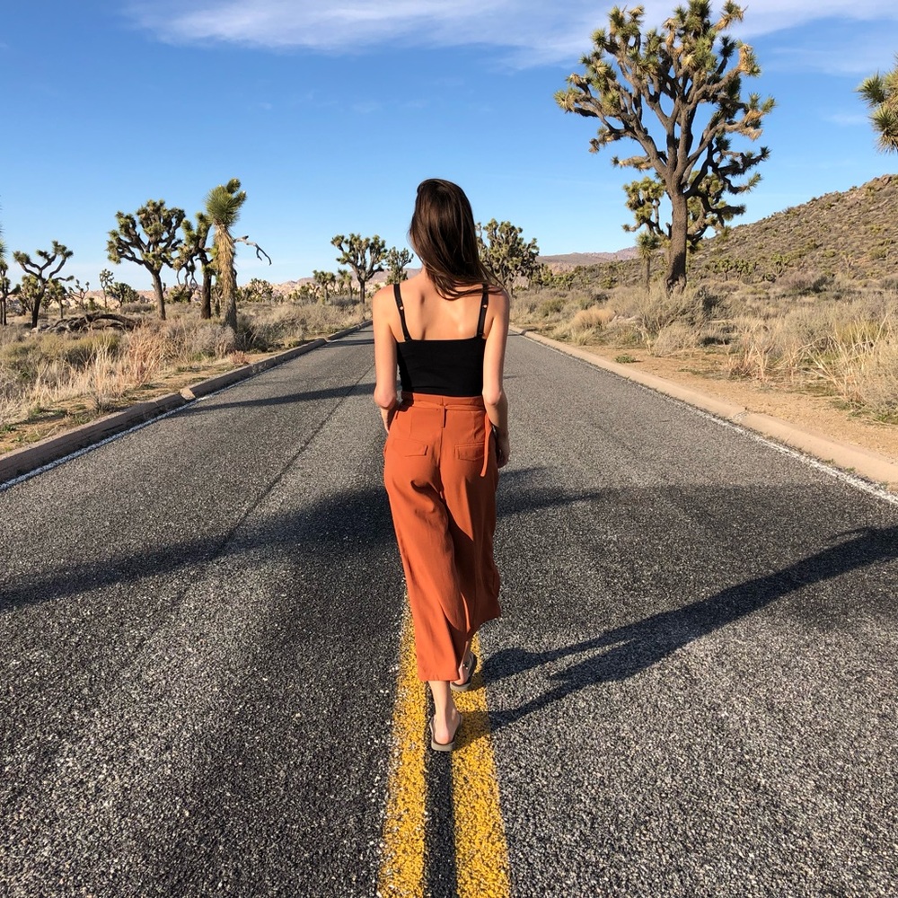 Flared burnt orange pants with belt S